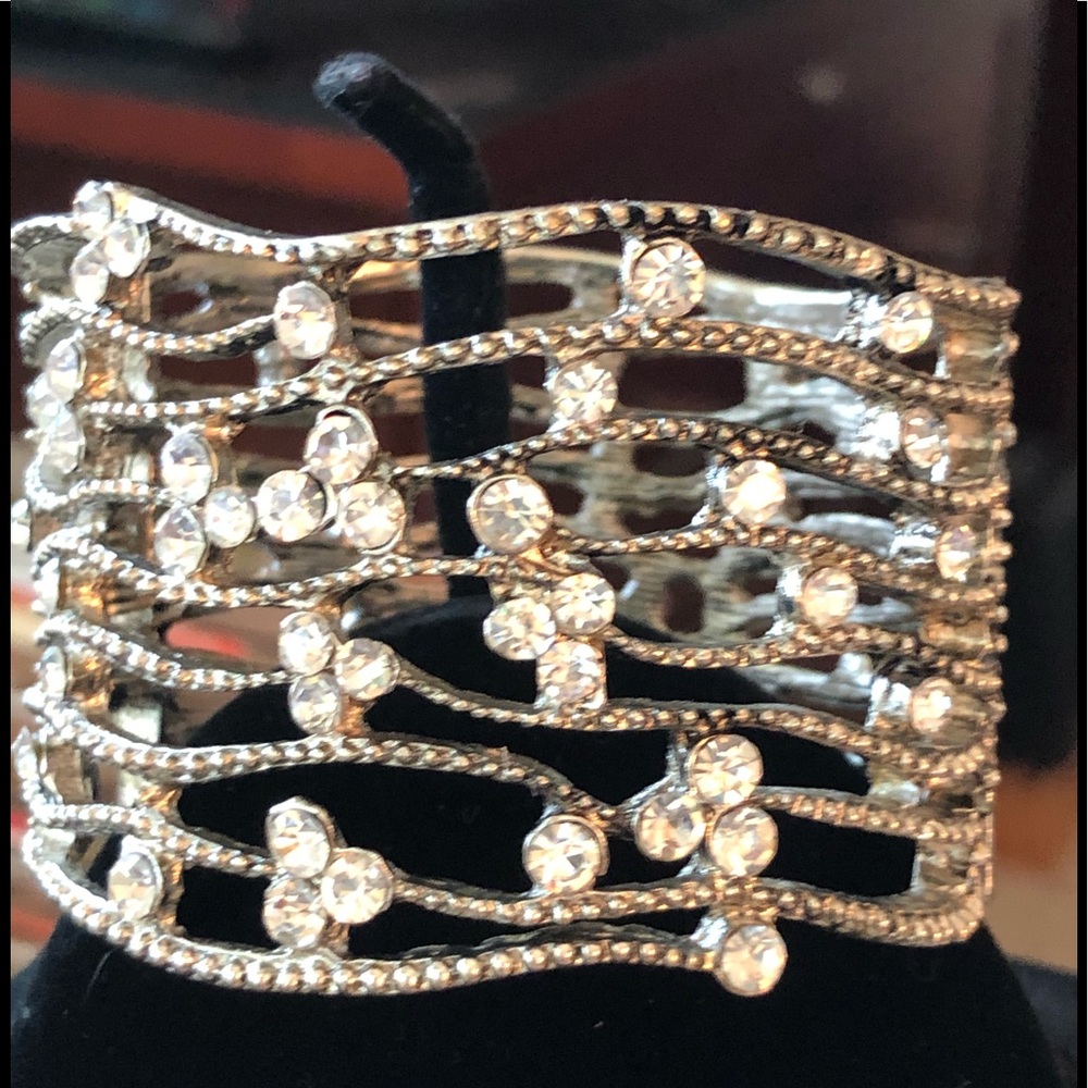 Stunning rhinestone and silver metal cuff.